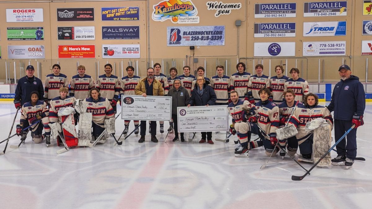 Darryl Schmidt of IBEW 993, along with José van Berkel of CUPE 3500, and Lois Rugg (KDLC President) of CUPE 4879 present cheques of $1000 to the Kamloops Storm Hockey Team